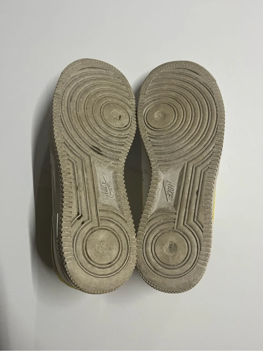 Nike White Low-Top Sneakers with Yellow Swoosh